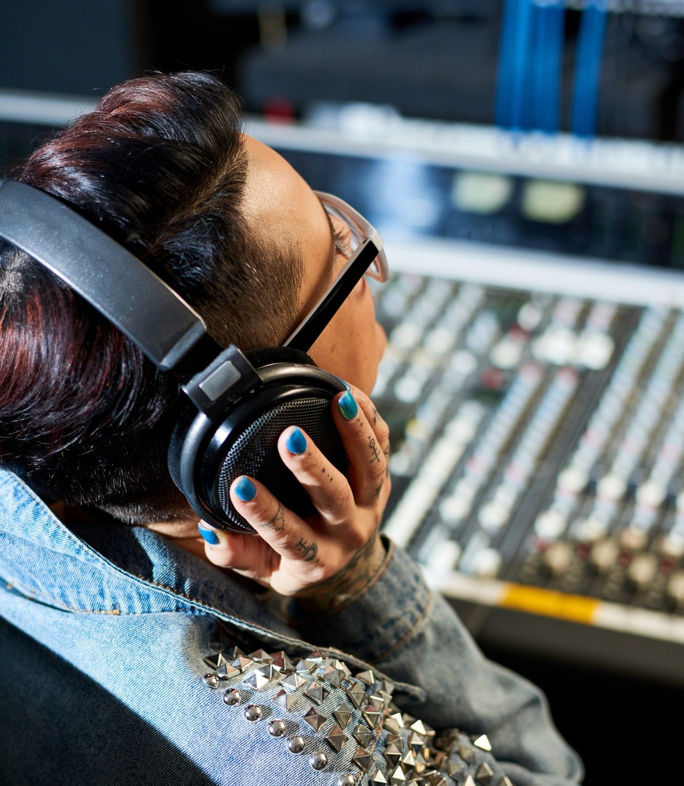 producer-listening-to-audio-track-in-studio-PY297D6.jpeg